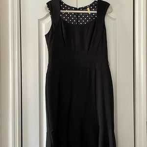 Lovely form flattering fully lined black dress with slight ruffle at the bottom.